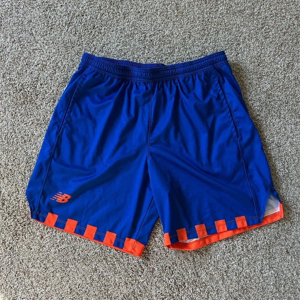 New Balance athletic shorts. EUC. Pockets. Elastic waist. Size Large.